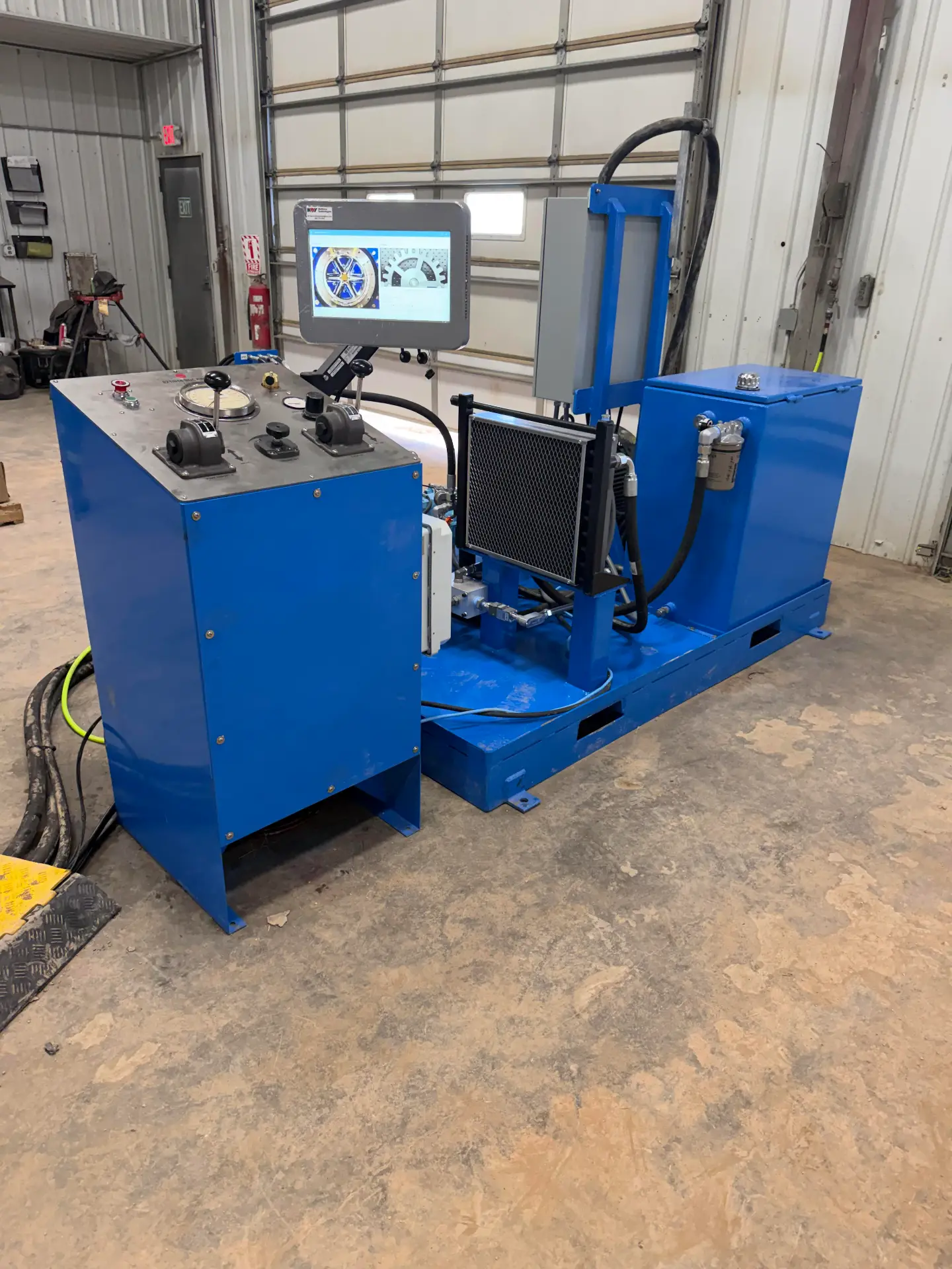 WOS NOV Torque Master bucking unit power pack in the Williston shop