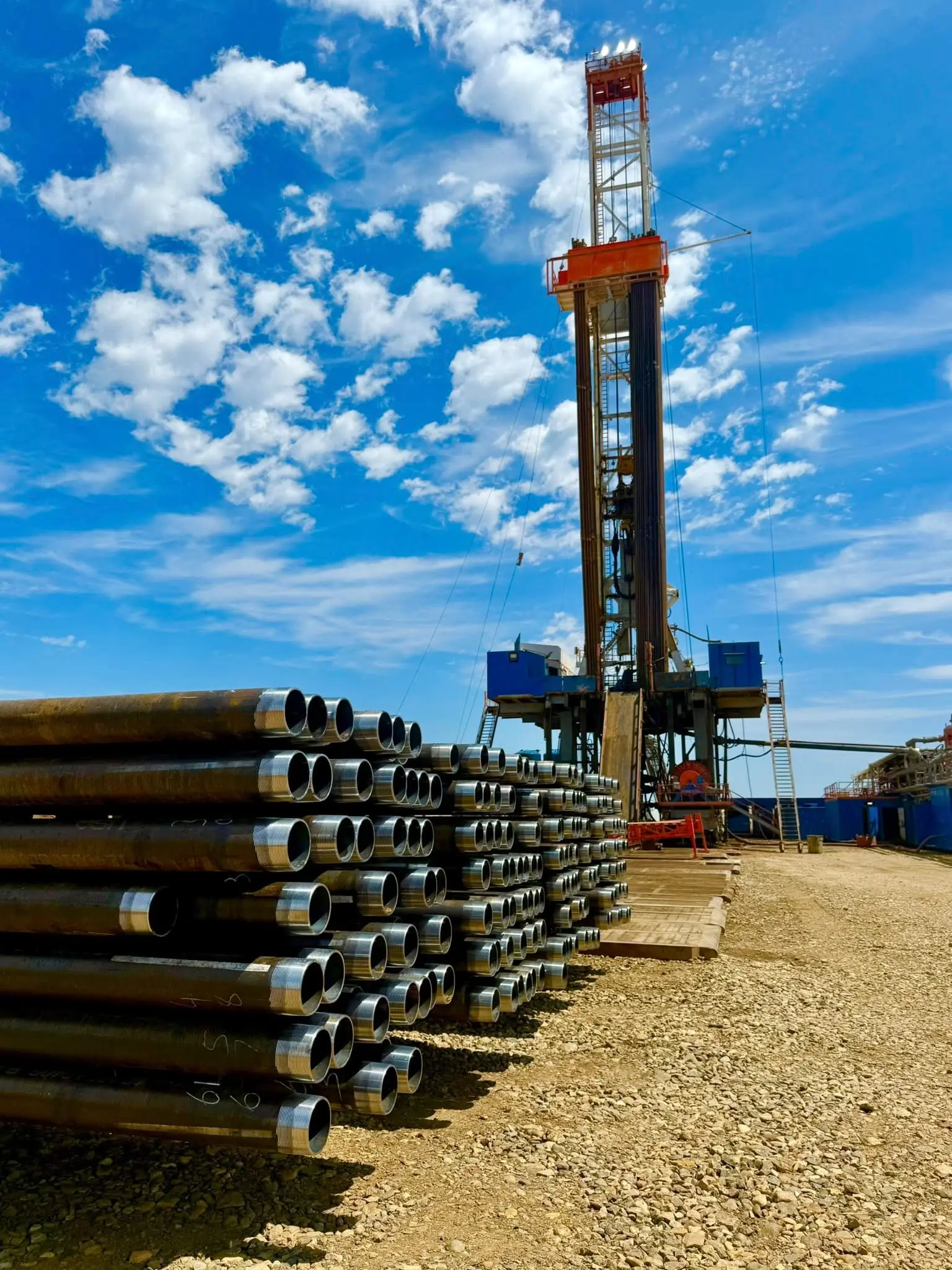 Workover rig with stacked casing pipe on a Bakken well site
