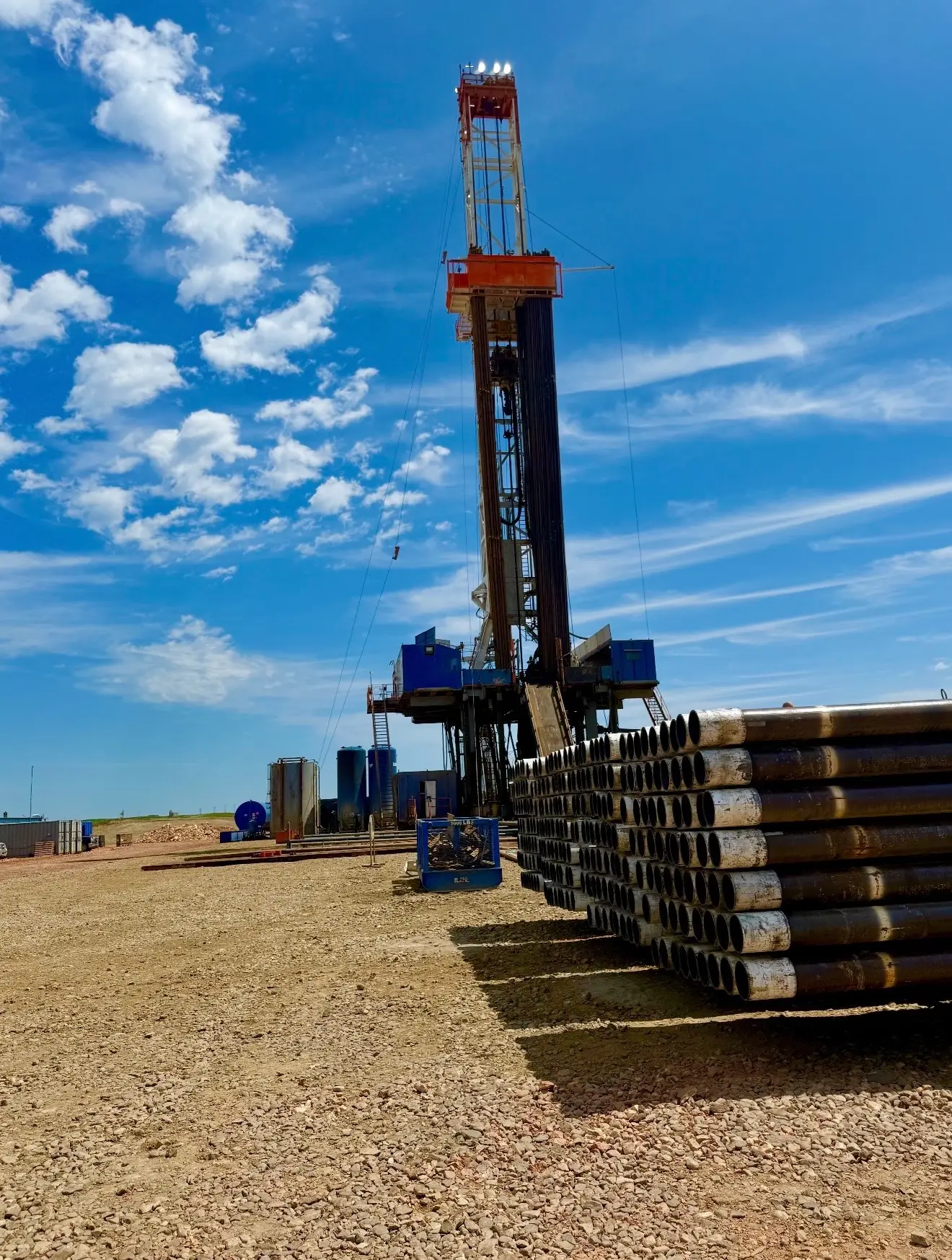 Workover rig with casing on a clear Bakken day