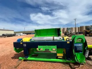 Green solids control centrifuge unit on a wellsite skid