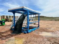 Blue mud system platform with conveyor staged on a Bakken location