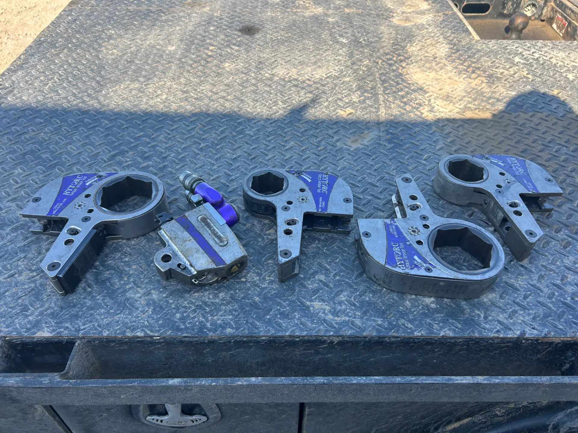 Hytorc hydraulic torque wrench tools staged on a WOS truck