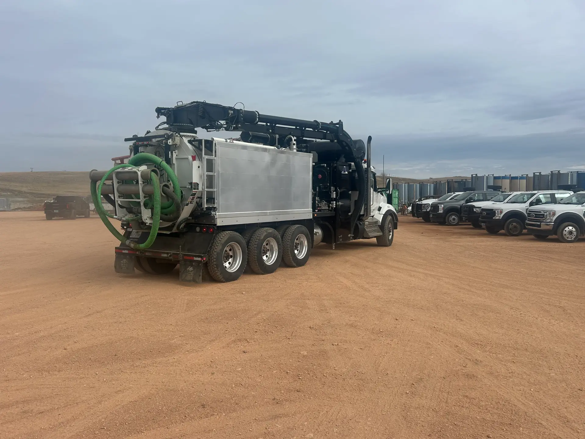 Rear view of WOS hydrovac fleet lined up