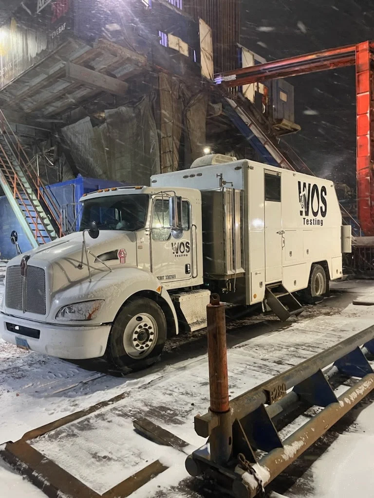 WOS Testing command unit truck working an indoor rig at night during winter pressure testing