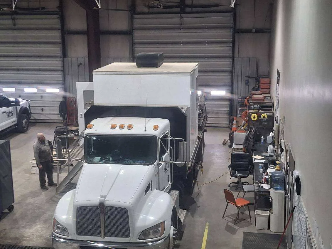 WOS pressure testing truck staged in the shop