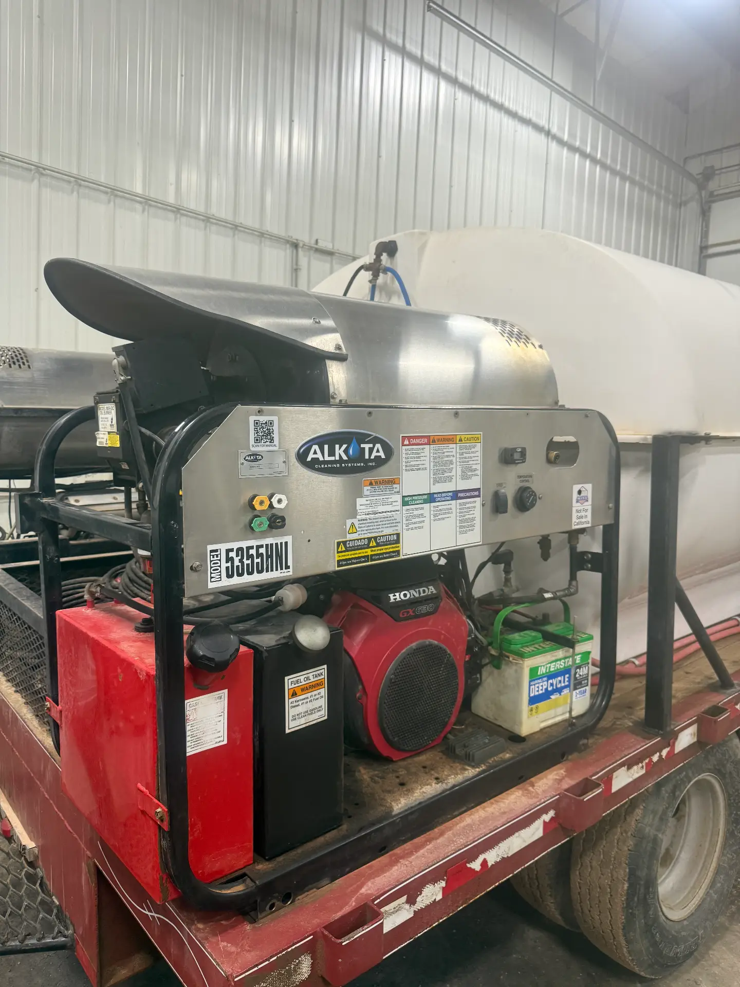 Alkota 5355HNL hot-water pressure washer with Honda engine mounted on a WOS skid trailer