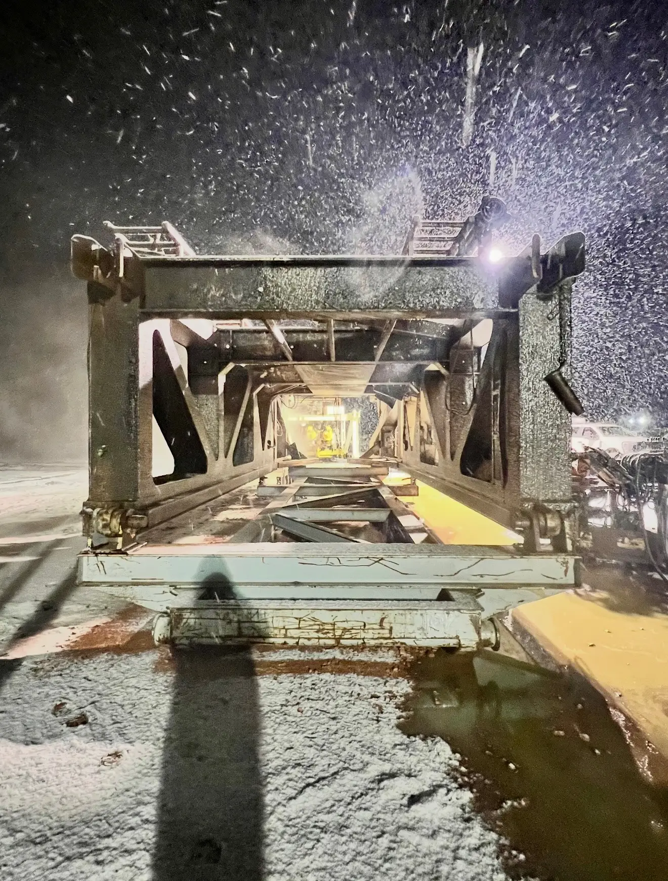 Pressure washing rig truss in a Bakken snowstorm