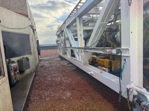 Rig truss staged for pressure washing