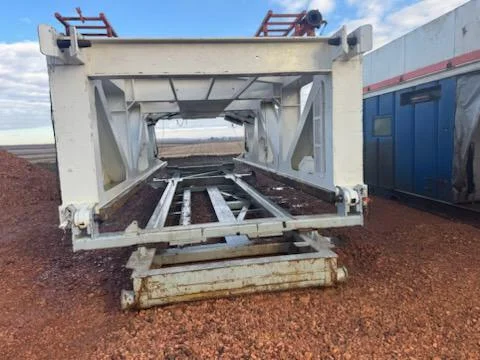 Painted rig component on stands awaiting pressure-wash service in the WOS yard