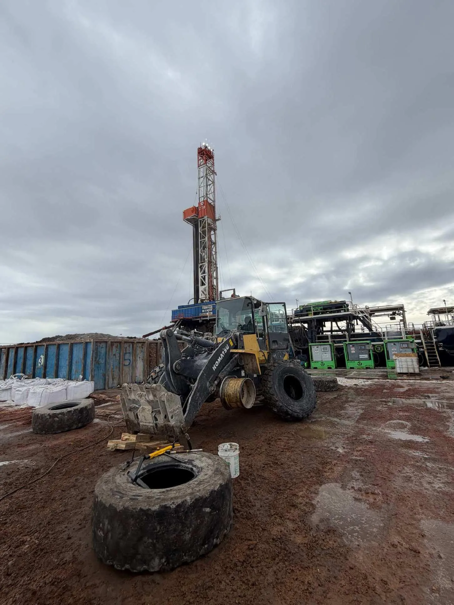 Roustabout drilling rig loader at work