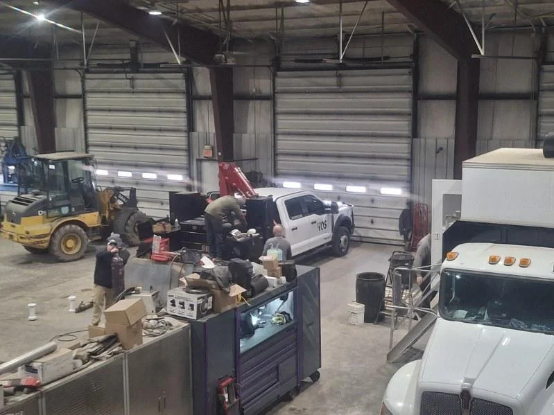 WOS crew working in the shop bay